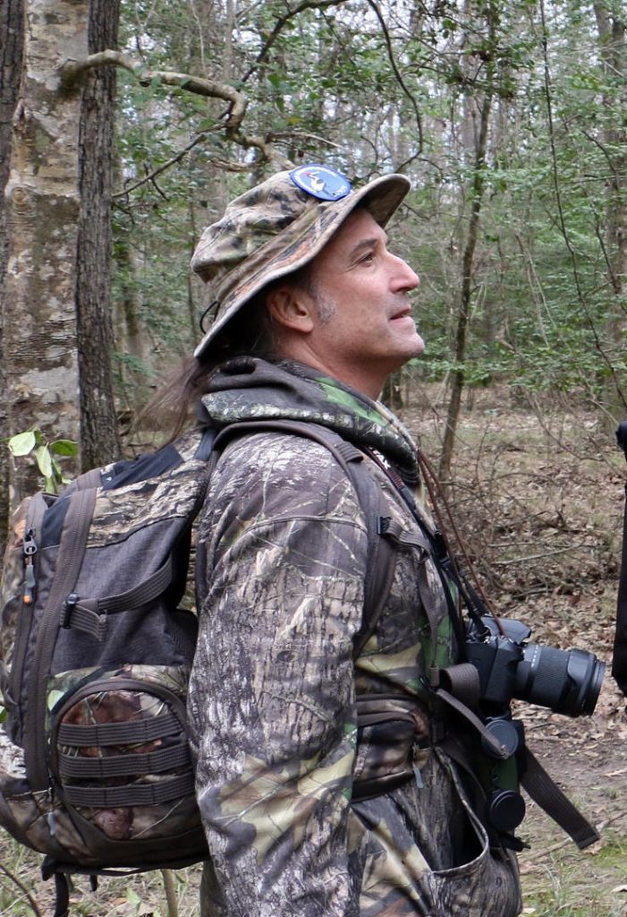 Mark Michaels wearing camo in the woods