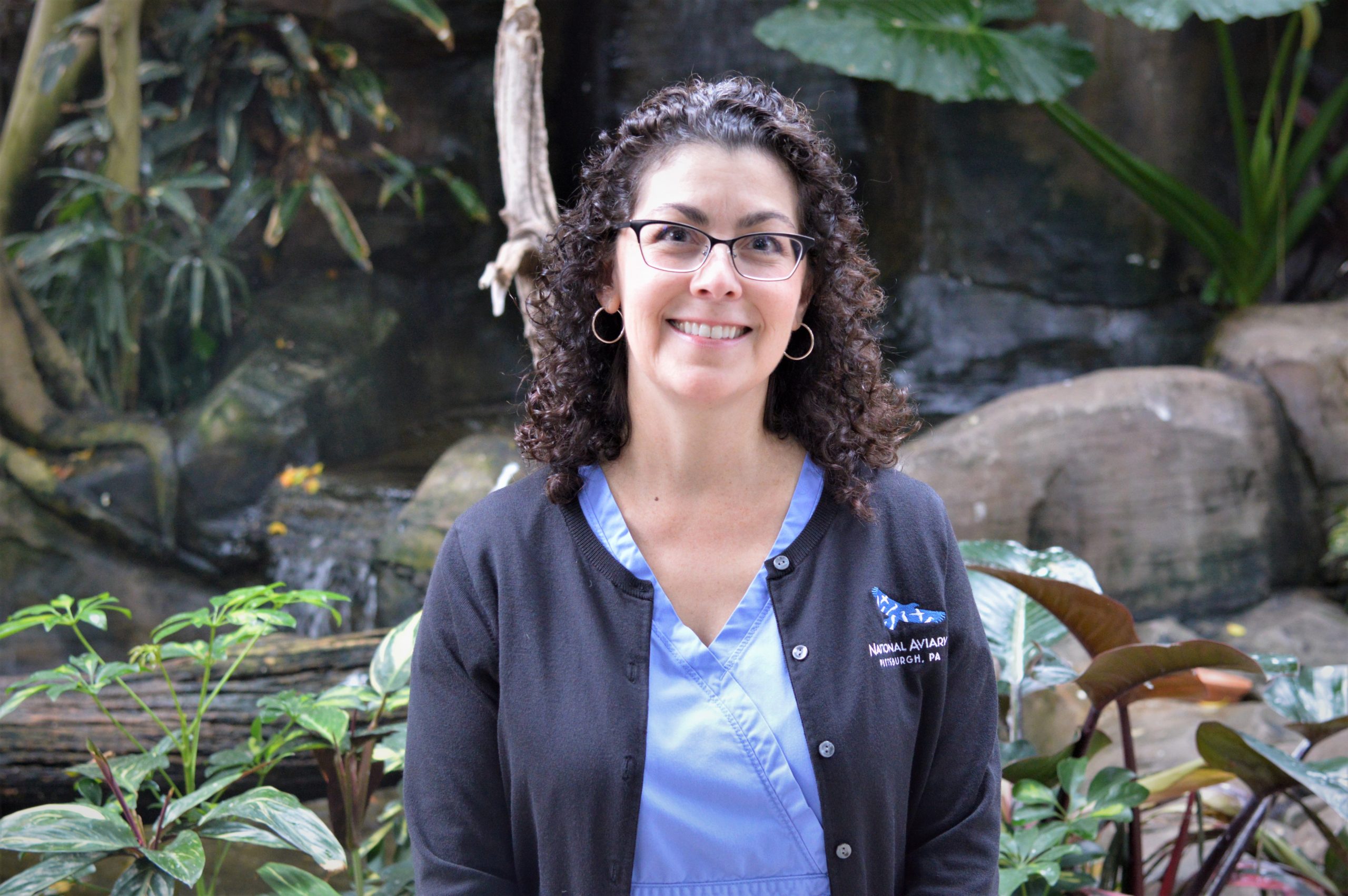 Dr. Pilar Fish in front of a waterfall