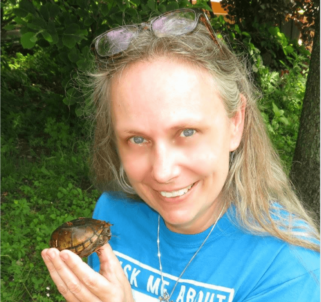 Patricia Johnson holding a small turtle
