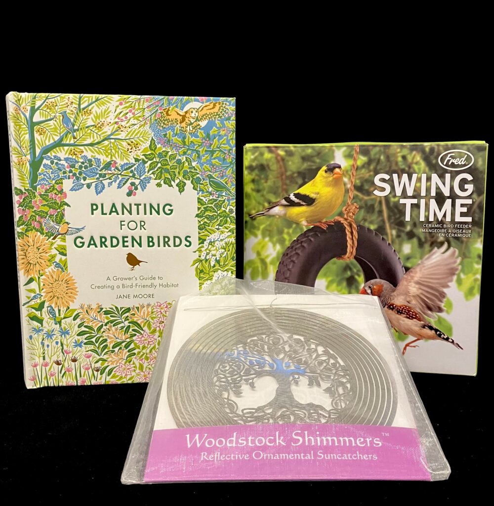 Items available for purchase at the National Aviary gift shop including a bird feeder and a guide to planting a garden book.