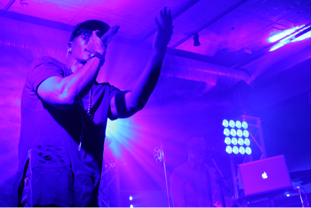 A lead singer hyping up the audience
