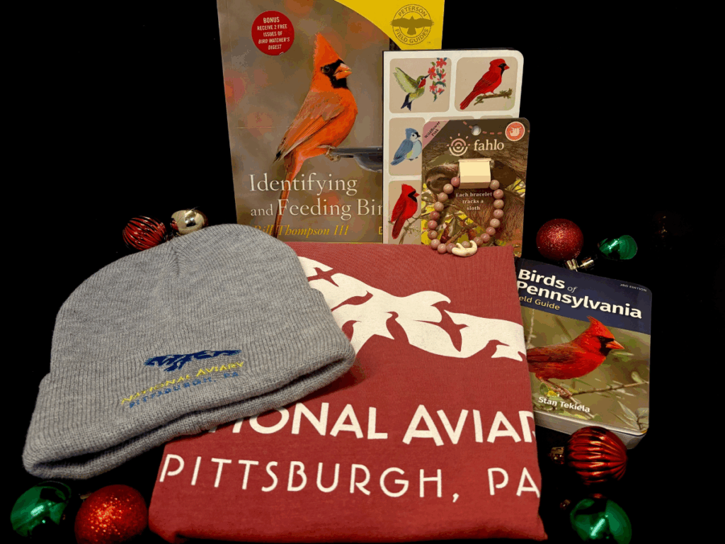 National Aviary branded beanie and shirt, plus guides for birding, and a Fahlo bracelet