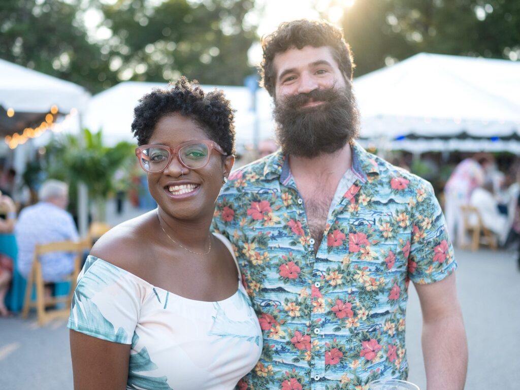 A husband and wife posing for a picture!