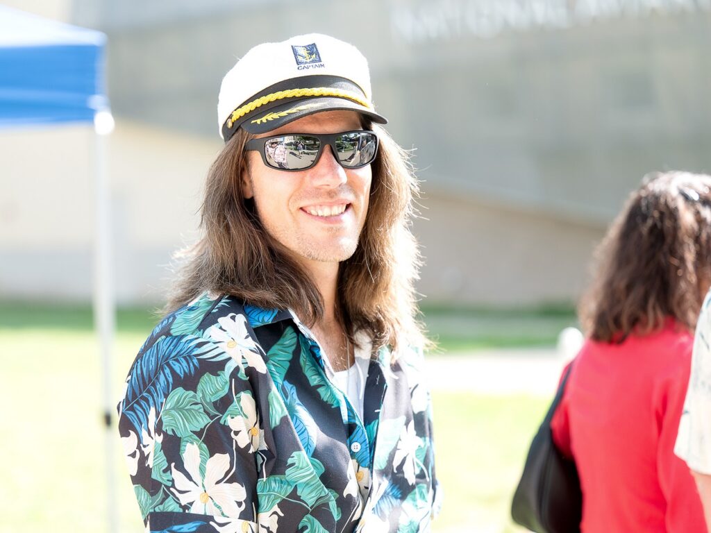 Night in the Tropics guest wearing a cruise captain hat!