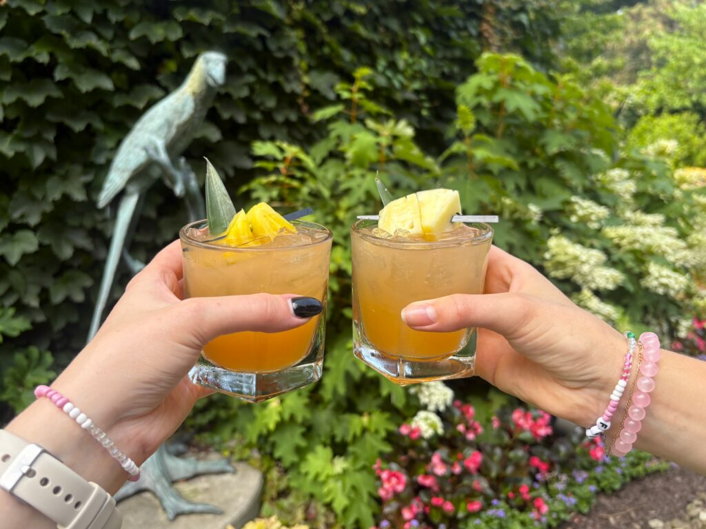 Two glasses clinking together